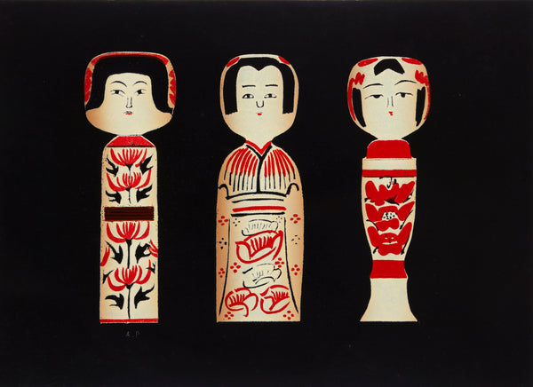 A square art print or card featuring three stylized Japanese doll figures in cream and red on a black background, photographed against a light gray wall.