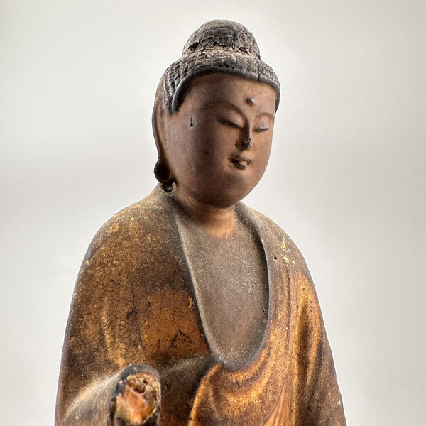 Standing antique buddha sculpture. Japanese. Kind, quiet, peaceful buddha