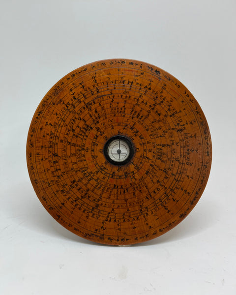 Hand-inscribed Japanese wooden raban (geomantic compass) with concentric directional rings surrounding a central magnetic compass.