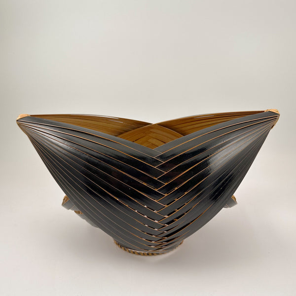 Decorative Ikebana vase with a unique, layered bamboo design coated in black lacquer