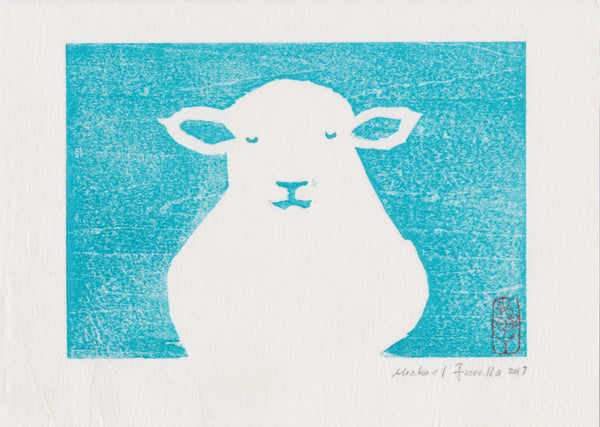 Original contemporary woodblock print by Michael Fiorella depicting a peaceful white lamb with closed eyes against a turquoise blue background.