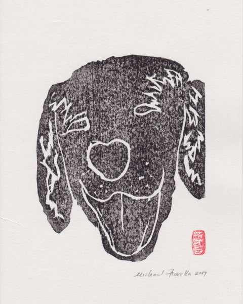 Black and white hand pulled woodcut of a dog's head with a heart shaped nose on a light beige background