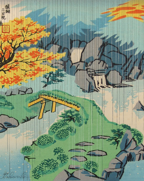 Traditional Japanese landscape with autumn trees, bridge, and rocks