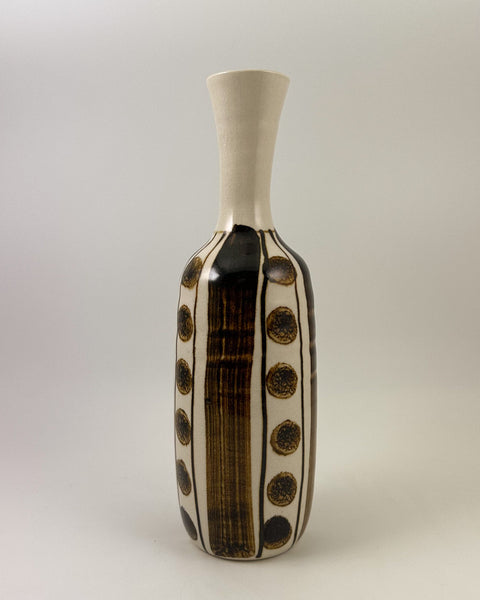 Vintage Japanese studio pottery bottle vase with iron-brown brush decoration and repeating circular motifs on a warm ivory glaze.