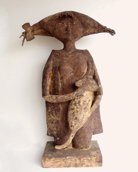 Unique late twentieth-century Japanese mixed media sculpture depicting a serene female figure embracing a cat, with dramatically extended hair and a richly textured earth-toned surface.