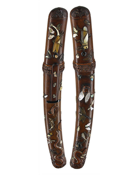Late Muromachi Kanekage wakizashi in rare carved wooden aikuchi koshirae decorated with insects, reptiles and mother-of-pearl inlay, accompanied by NBTHK Hozon papers.