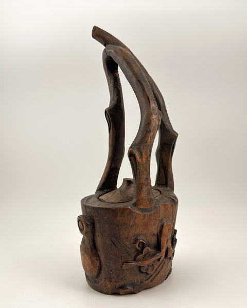 Signed antique Japanese bamboo root ikebana vessel with carved plum blossom decoration and fitted removable lid.