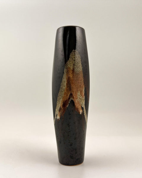Vintage Japanese studio pottery bottle vase with glossy black glaze and expressive crystalline brown and ash glaze decoration.